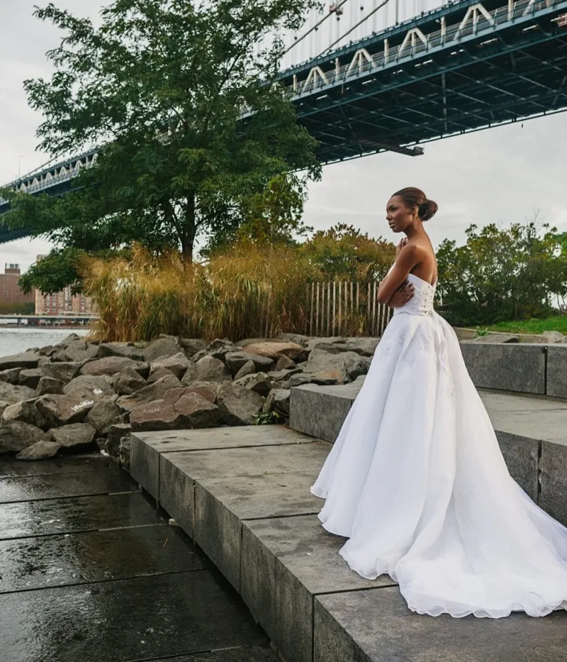 Ophelia. A bride in a strapless couture ballgown on the riverside steps beneath the Manhattan Bridge.