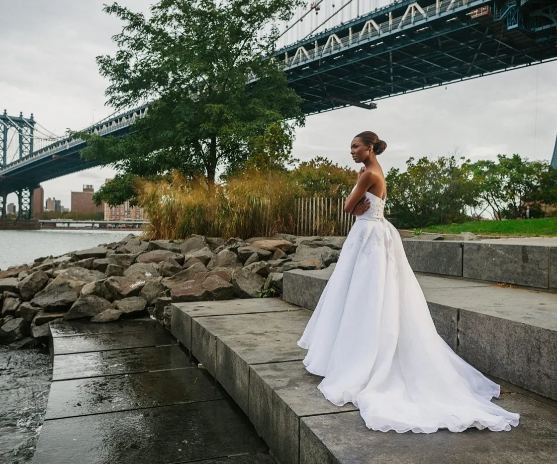 Ophelia. A bride in a strapless couture ballgown on the riverside steps beneath the Manhattan Bridge.