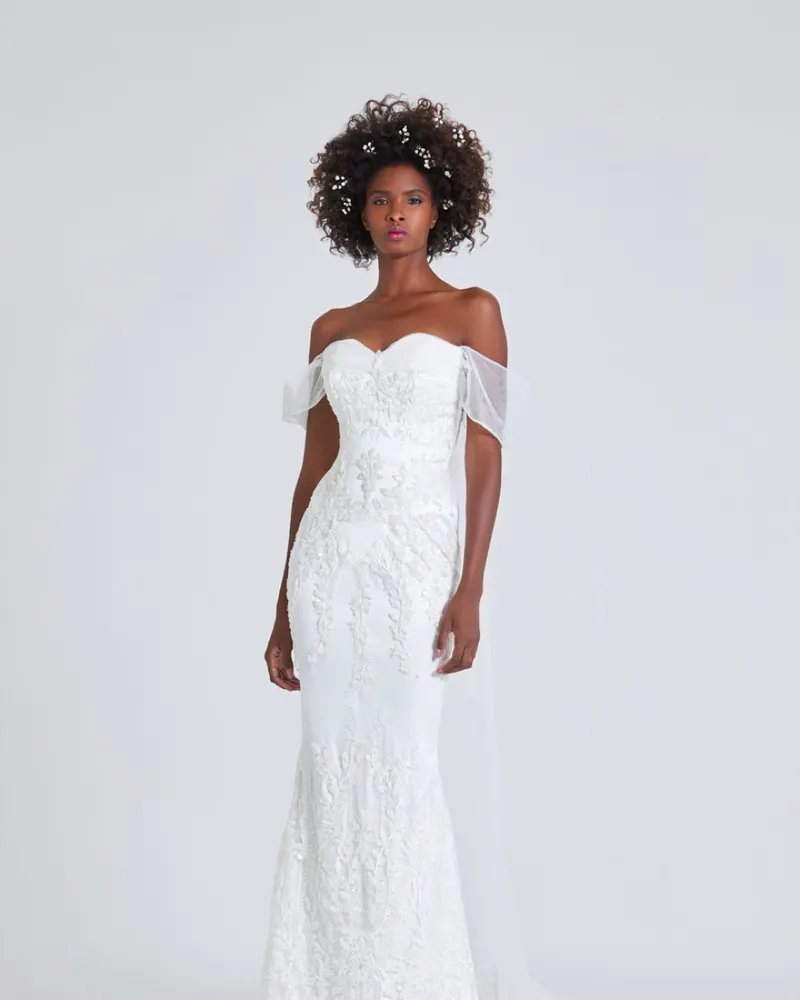 Ajoke, front. Off-the-shoulder gown with a soft draped bodice and a slim skirt.
