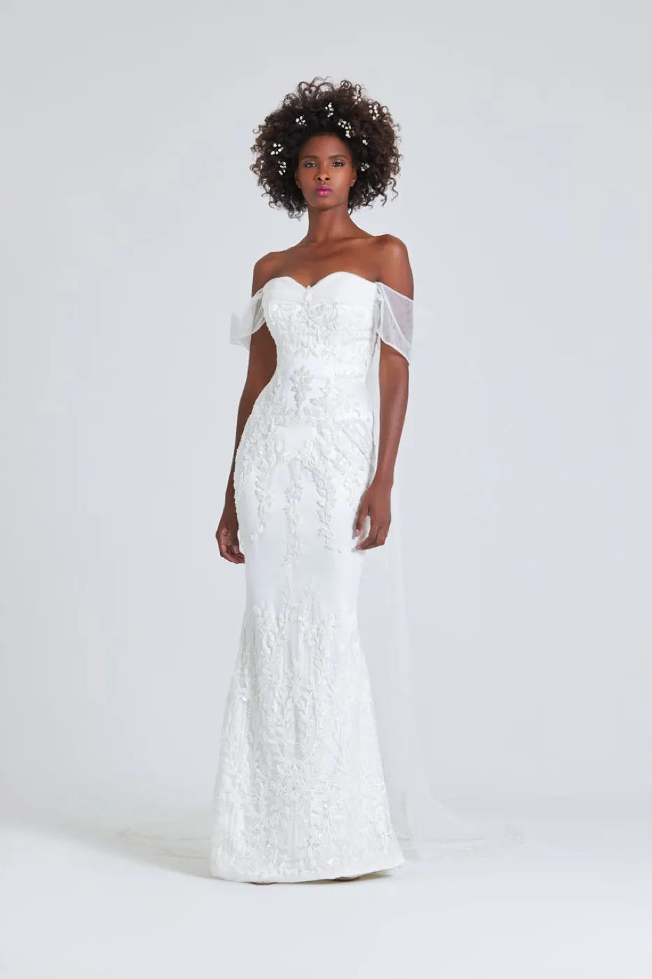 Ajoke, front. Off-the-shoulder gown with a soft draped bodice and a slim skirt.